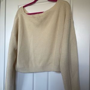 cable-knit cream sweater
